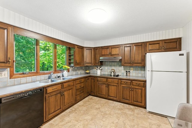 26 Ashfield Ln, South Hadley, MA 01075 - kitchen with black appliances, under cabinet range hood, tasteful backsplash, and brown cabinets