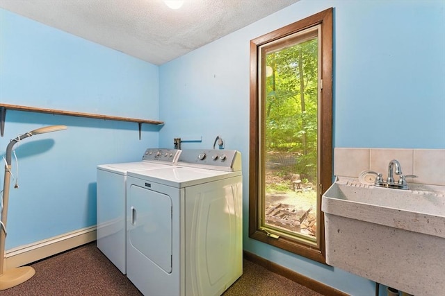 26 Ashfield Ln, South Hadley, MA 01075 - laundry area featuring washing machine and dryer, baseboard heating, a textured ceiling, and carpet