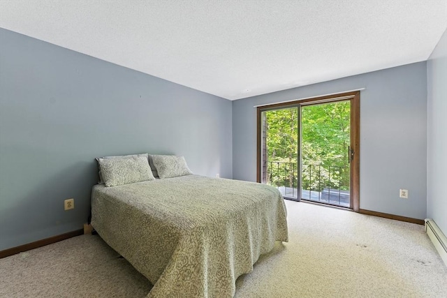 26 Ashfield Ln, South Hadley, MA 01075 - carpeted bedroom with a baseboard radiator and access to exterior