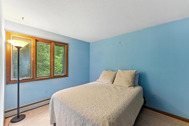 26 Ashfield Ln, South Hadley, MA 01075 - bedroom featuring a baseboard heating unit and a textured ceiling