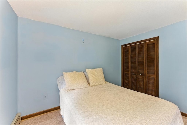 26 Ashfield Ln, South Hadley, MA 01075 - bedroom featuring baseboard heating, light carpet, and a closet
