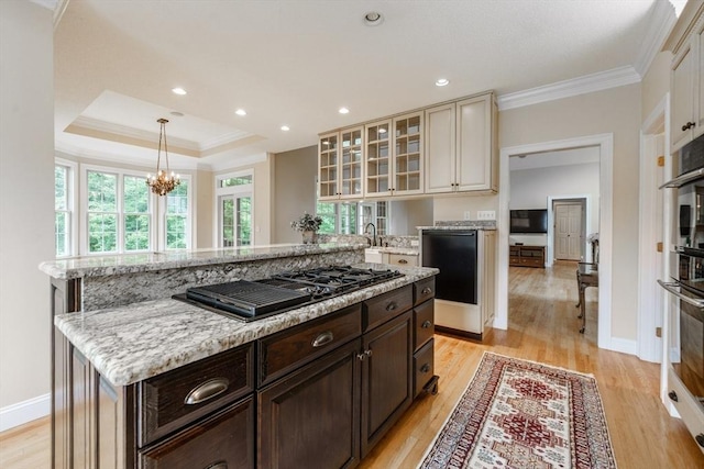 9 Windsor Ln, East Longmeadow, MA 01028 - kitchen with black appliances, crown molding, a center island, light wood finished floors, and dark brown cabinets
