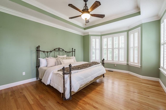 9 Windsor Ln, East Longmeadow, MA 01028 - bedroom with multiple windows, light wood-type flooring, a raised ceiling, and crown molding