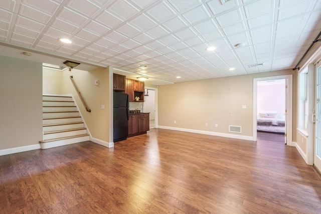 9 Windsor Ln, East Longmeadow, MA 01028 - unfurnished living room with wood finished floors, stairs, and recessed lighting