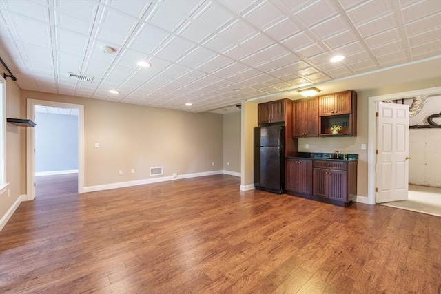 9 Windsor Ln, East Longmeadow, MA 01028 - kitchen with freestanding refrigerator, dark countertops, wood finished floors, recessed lighting, and open floor plan