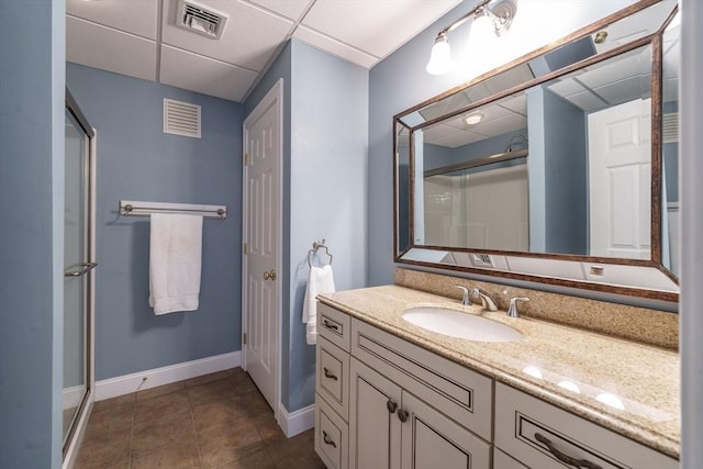 9 Windsor Ln, East Longmeadow, MA 01028 - bathroom featuring a shower stall, vanity, a drop ceiling, and tile patterned floors