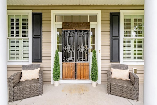 9 Windsor Ln, East Longmeadow, MA 01028 - doorway to property with covered porch