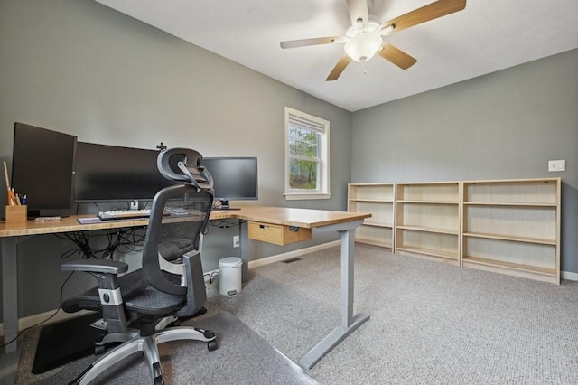 home office with carpet flooring, baseboards, and ceiling fan