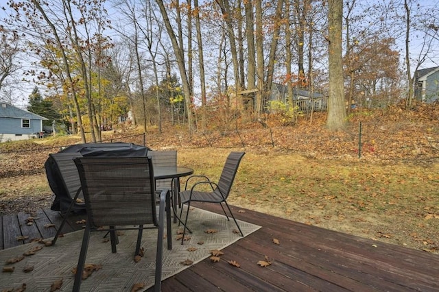 wooden terrace featuring outdoor dining space