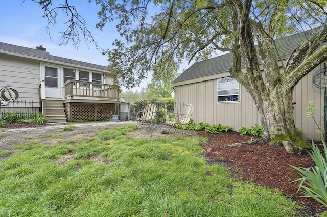 view of yard featuring a wooden deck and stairway