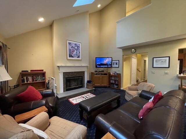 9201 Mountainside Dr Unit 9201, Hancock, MA 01237 - living area featuring high vaulted ceiling, carpet, a fireplace, recessed lighting, and a skylight
