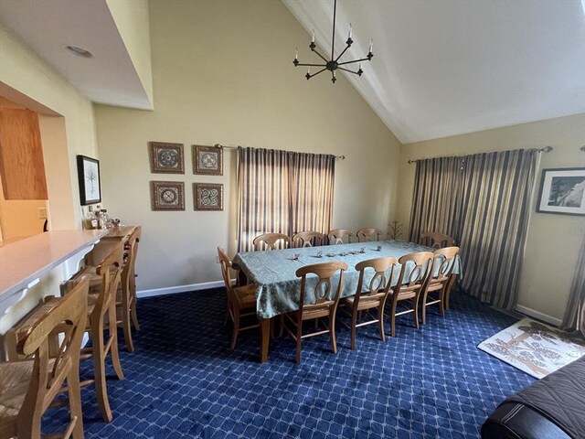 9201 Mountainside Dr Unit 9201, Hancock, MA 01237 - dining space featuring dark carpet, high vaulted ceiling, baseboards, and a chandelier