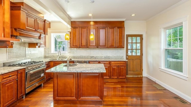 kitchen featuring a sink, visible vents, light stone counters, and stainless steel range