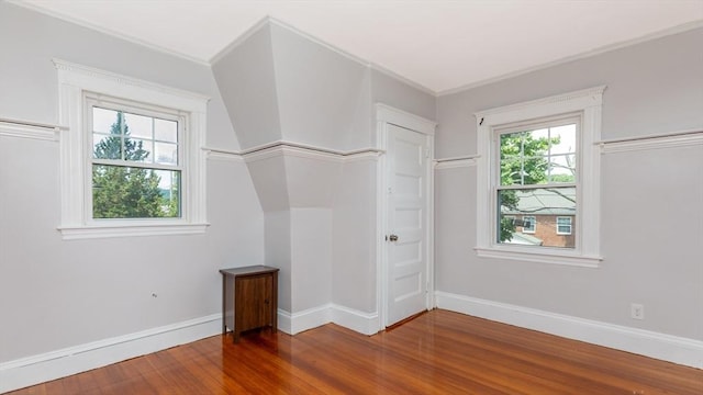 interior space featuring wood finished floors and baseboards