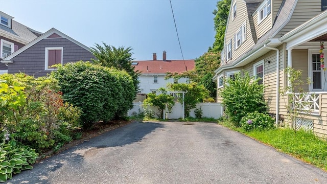 view of side of property featuring fence