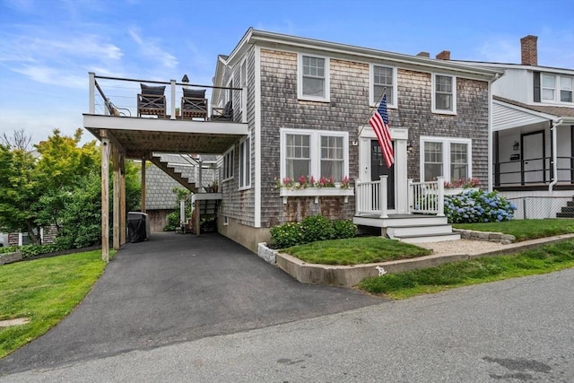 16 Squanto Rd, Weymouth, MA 02191 - view of front of home with stairs, a chimney, and driveway