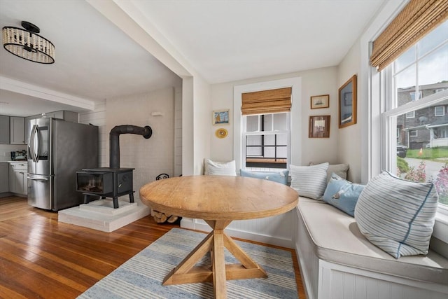 16 Squanto Rd, Weymouth, MA 02191 - dining room featuring a wood stove and wood finished floors