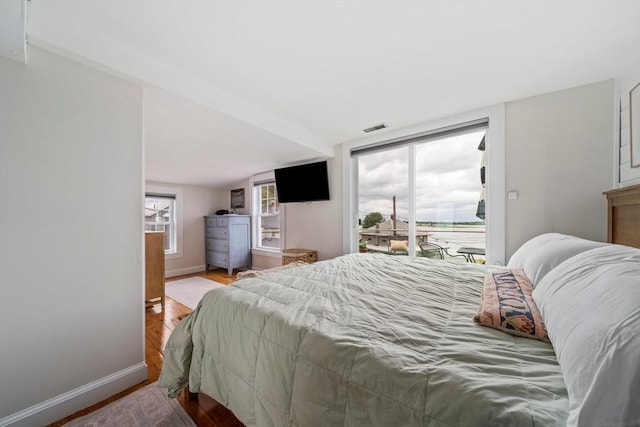 16 Squanto Rd, Weymouth, MA 02191 - bedroom with access to exterior and wood finished floors