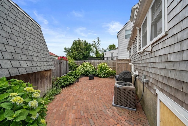 16 Squanto Rd, Weymouth, MA 02191 - fenced backyard with a patio area