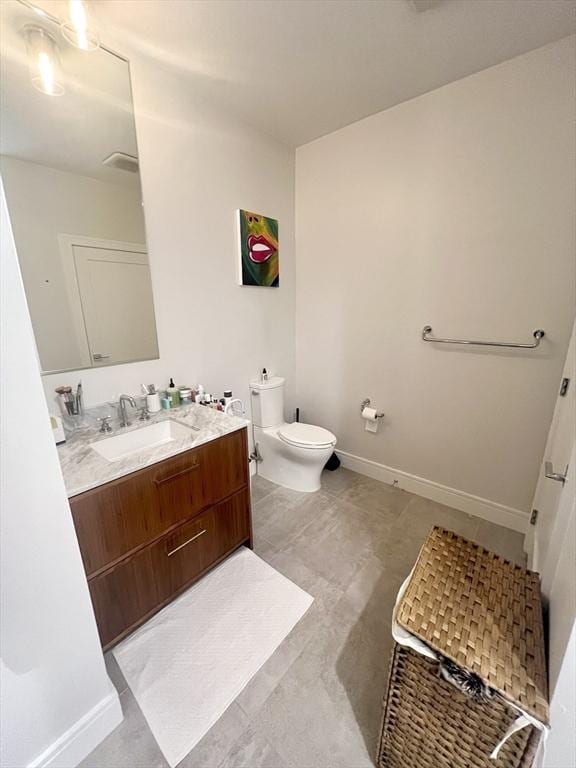 99 Sumner St Unit 503, Boston, MA 02128 - bathroom with vanity, toilet, baseboards, and tile patterned flooring