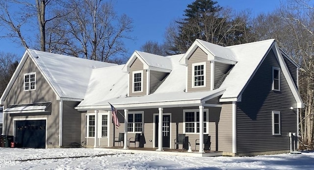 cape cod house featuring a porch