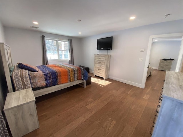 bedroom with hardwood / wood-style floors