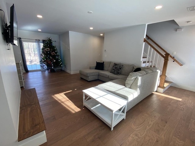 living room featuring dark wood-type flooring