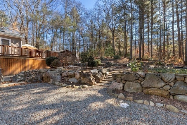 view of yard with a wooden deck