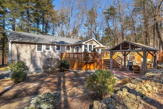 back of house with a gazebo, stairway, and a wooden deck