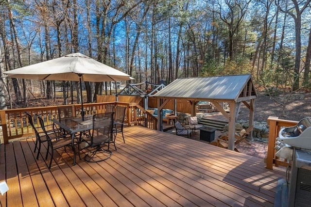 wooden deck with outdoor dining space