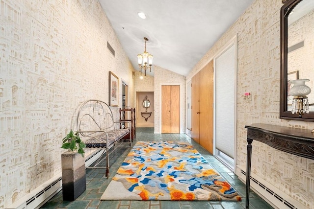 hall with lofted ceiling, a baseboard radiator, and an inviting chandelier