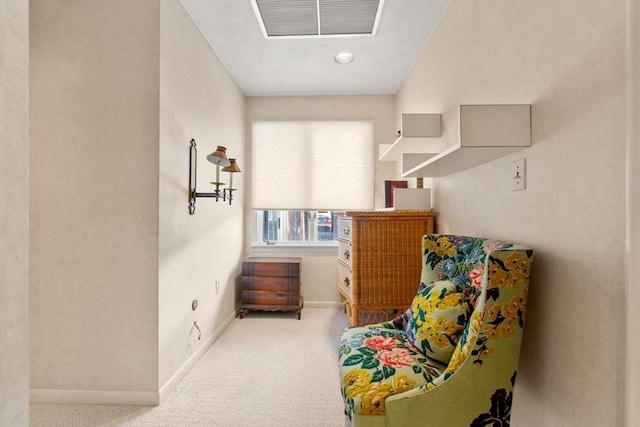 sitting room featuring carpet floors