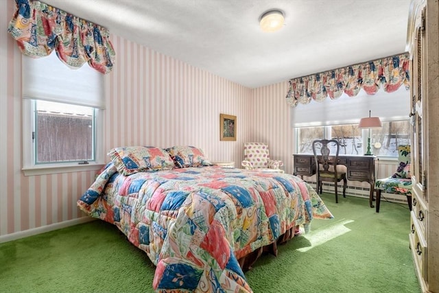 carpeted bedroom featuring multiple windows and a baseboard heating unit