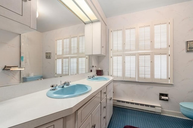 bathroom featuring tile patterned flooring, a baseboard radiator, vanity, and toilet