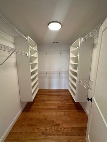 spacious closet with wood finished floors