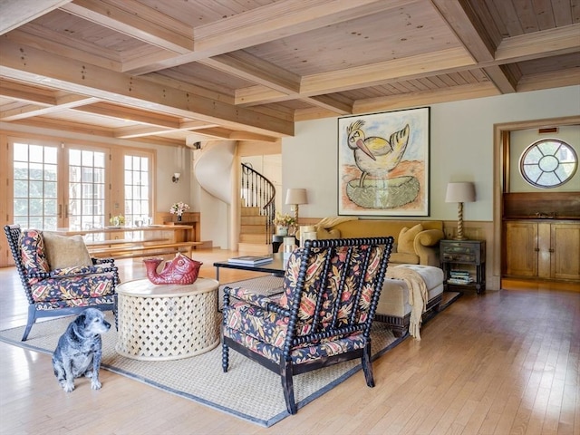 living room with beam ceiling, light hardwood / wood-style floors, coffered ceiling, and wooden ceiling