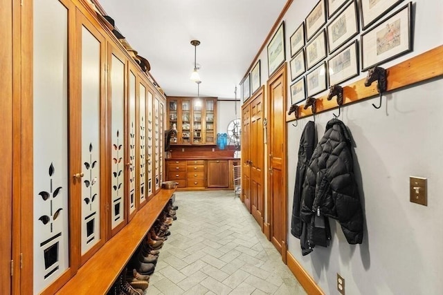 mudroom featuring ornamental molding