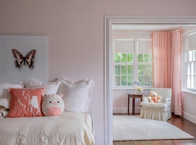 bedroom with wood-type flooring