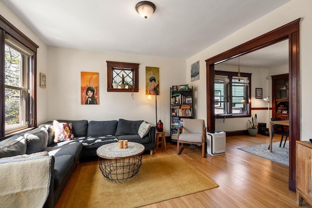 living area featuring healthy amount of natural light and wood finished floors