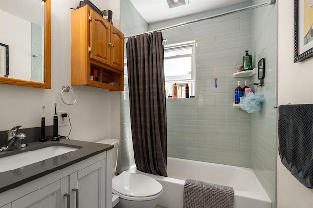 full bathroom with toilet, shower / bath combination with curtain, and vanity