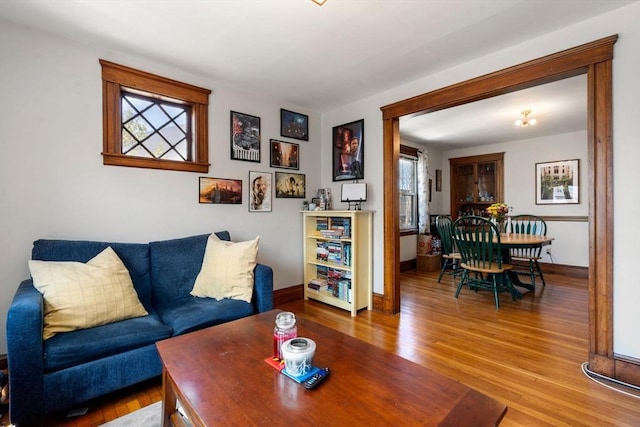 living room with wood finished floors and baseboards