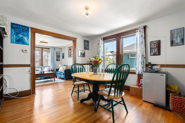 dining area featuring light wood-style floors
