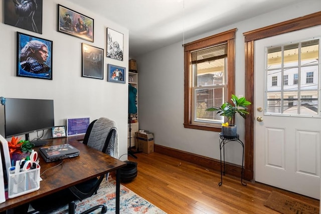 office area with wood finished floors and baseboards