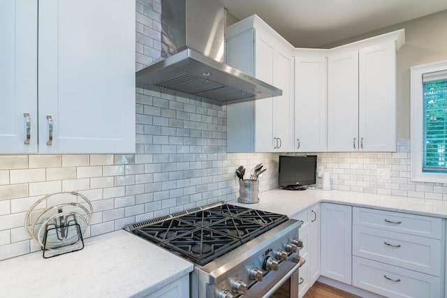 3 Ethan Cir, South Hadley, MA 01075 - kitchen featuring wall chimney exhaust hood, high end range, backsplash, light stone counters, and white cabinets