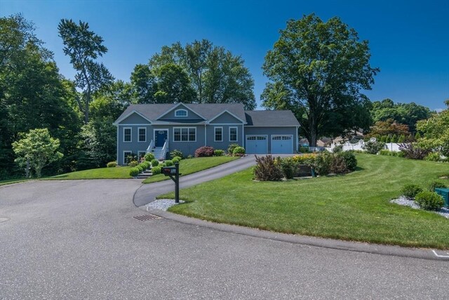 3 Ethan Cir, South Hadley, MA 01075 - view of front facade with an attached garage, driveway, and a front yard