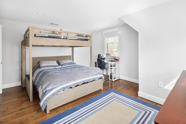 bedroom featuring recessed lighting, wood finished floors, visible vents, and baseboards