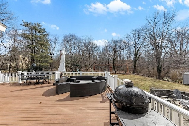 deck featuring outdoor dining space and outdoor lounge area