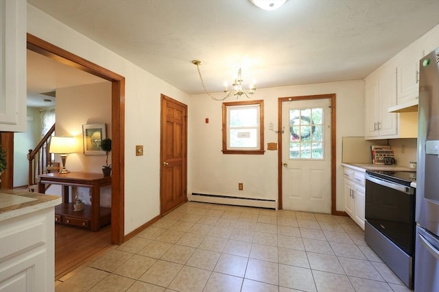 439 S St Unit A, Plainville, MA 02762 - kitchen featuring appliances with stainless steel finishes, a baseboard heating unit, a chandelier, and white cabinetry