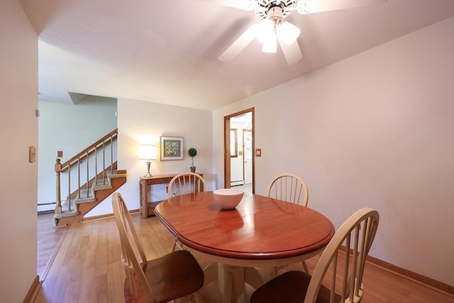 439 S St Unit A, Plainville, MA 02762 - dining room featuring stairway, light wood-style floors, a ceiling fan, and a baseboard radiator