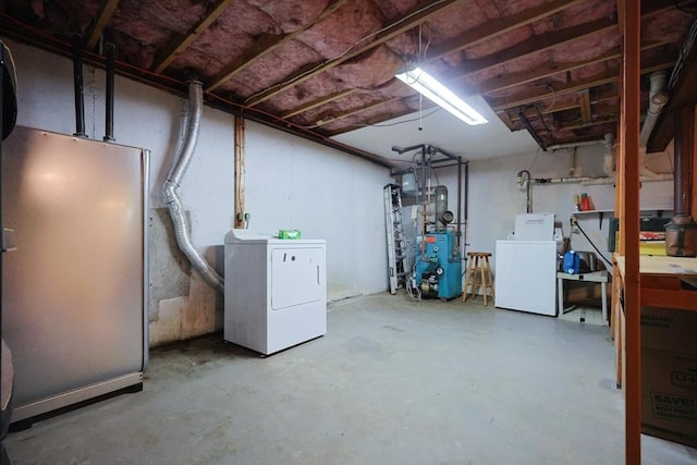 439 S St Unit A, Plainville, MA 02762 - unfinished basement with independent washer and dryer, fridge, and a heating unit